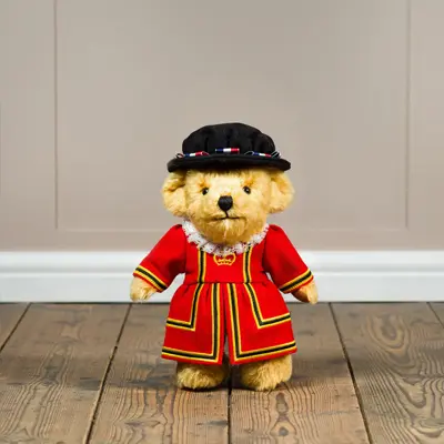 Teddy bear in a red tunic
