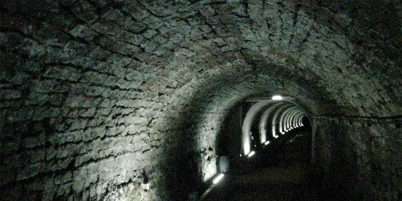 Inside the dark brick Victoria Tunnel