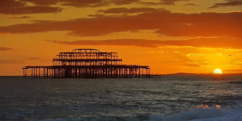 Skeletal remains of the West Pier at sunset