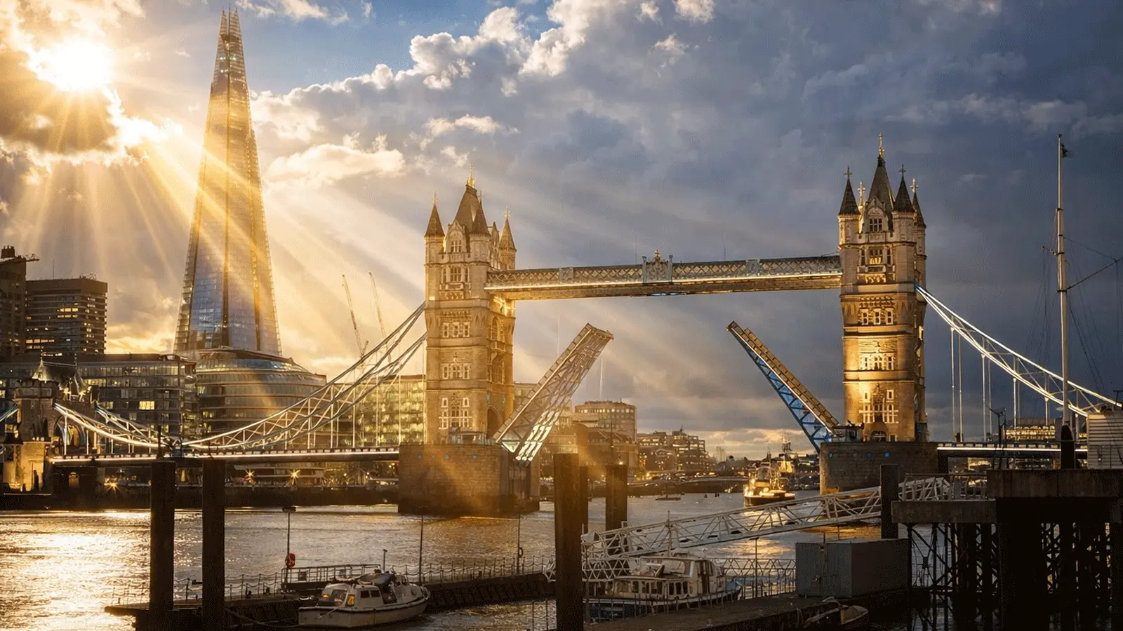 Tower Bridge and the River Thames at sunset, with the Shard in the background