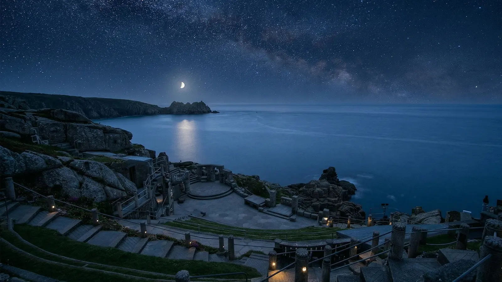 Minack Theatre Visitor Guide Banner featuring the dramatic cliffside theatre