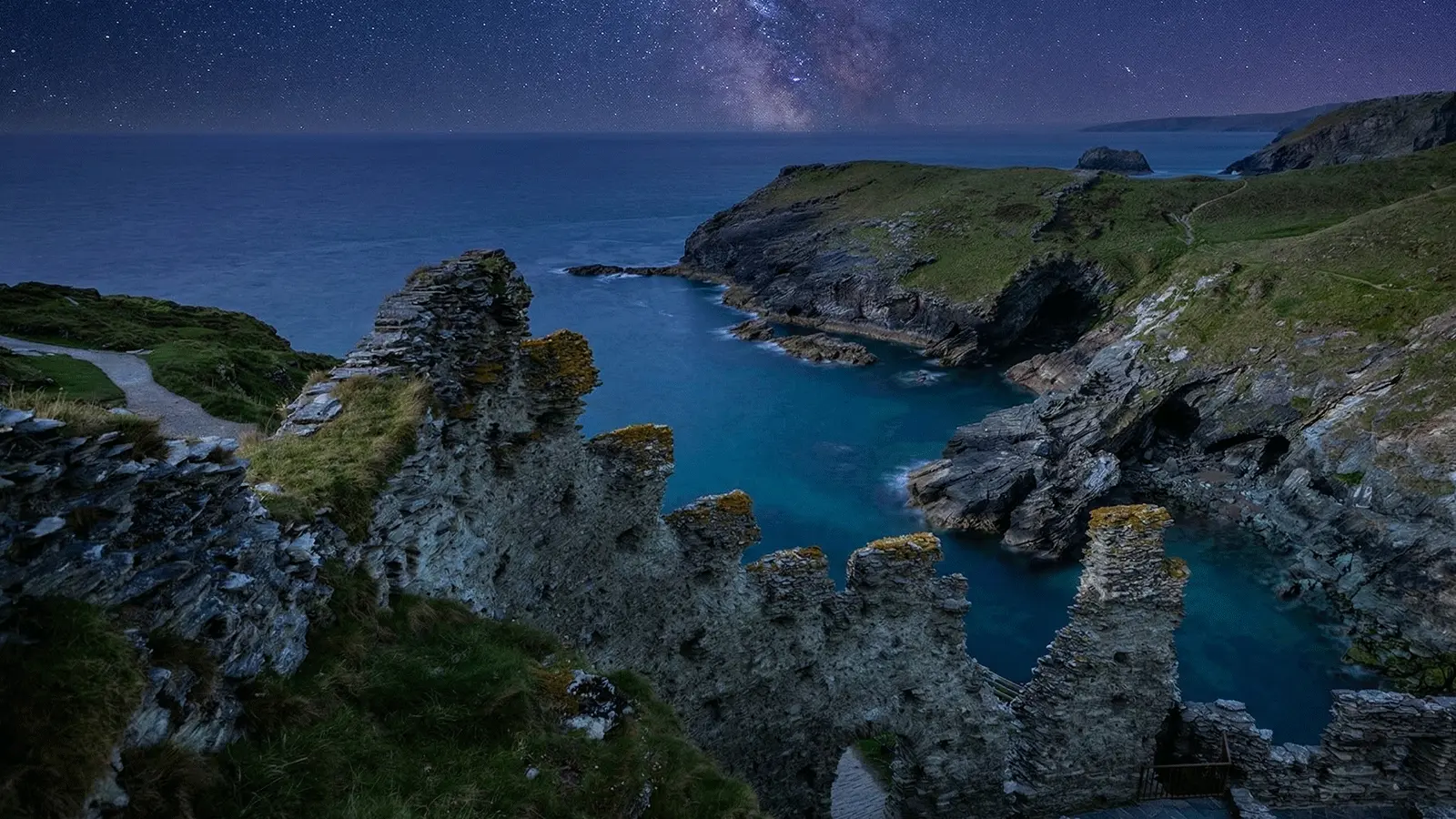 Tintagel Castle Visitor Guide Banner featuring the dramatic headland ruins