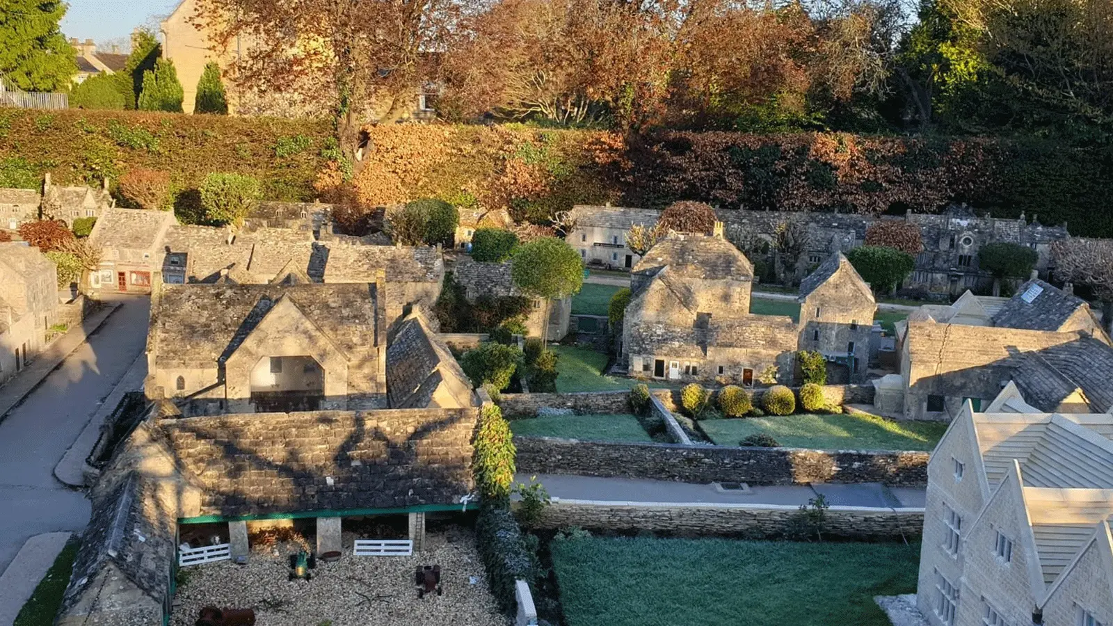 Bourton Model Village Visitor Guide Banner featuring the charming miniature village