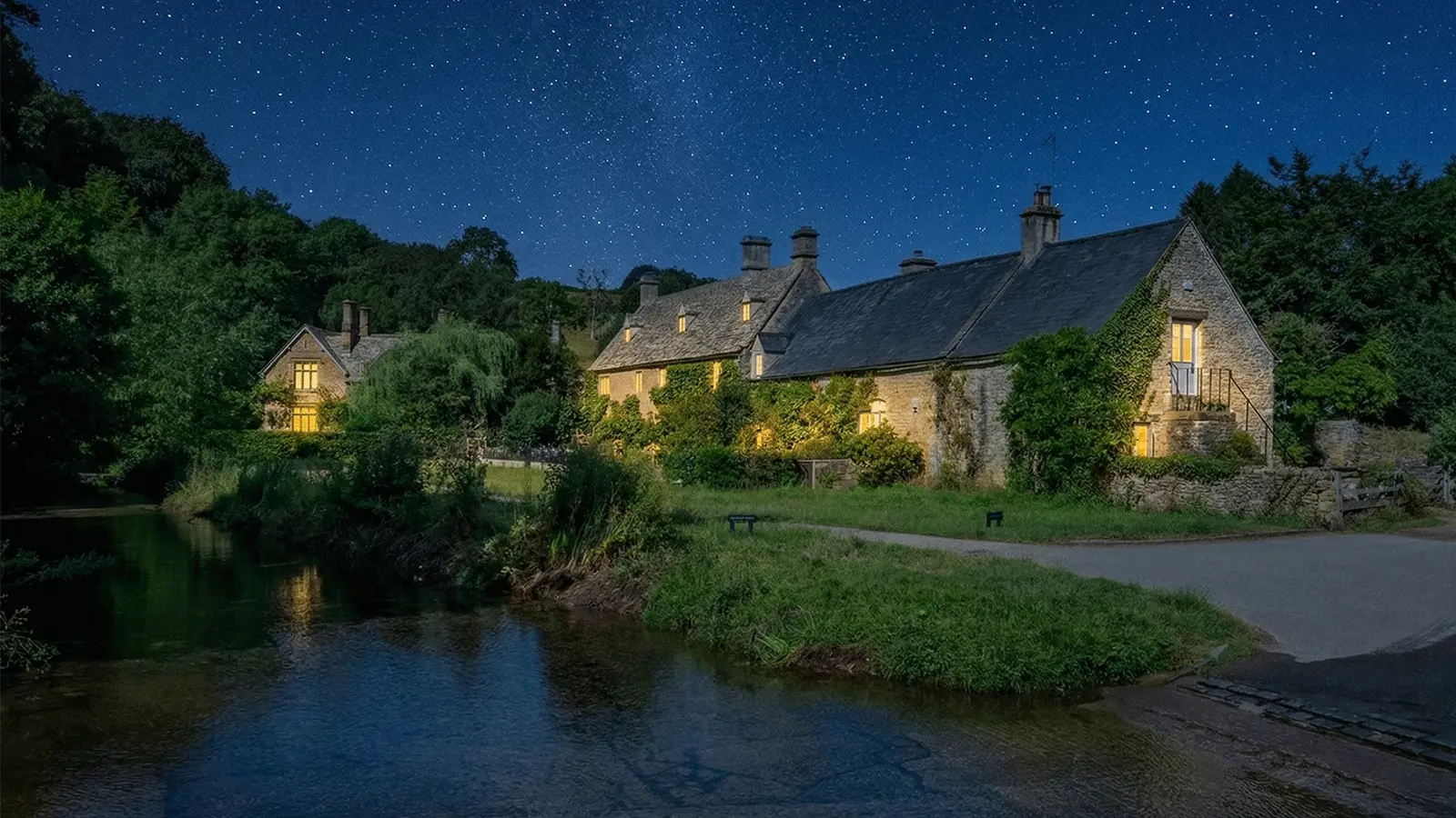 The Slaughters Cotswolds Visitor Guide Banner featuring the honey stone cottages and River Eye