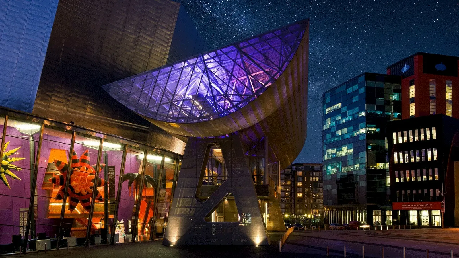 Salford Quays waterfront serving as the banner for Manchester attractions