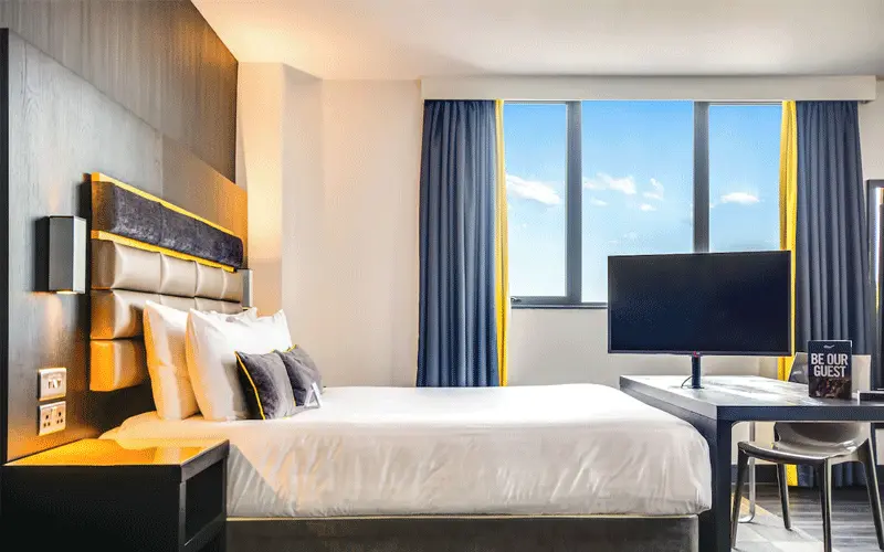 Roomzzz Chester City offering stylish aparthotel suites overlooking Chester Racecourse.